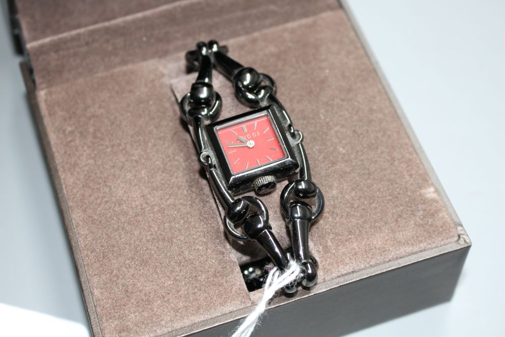 A ladys blackened steel Gucci Signora quartz wrist watch,